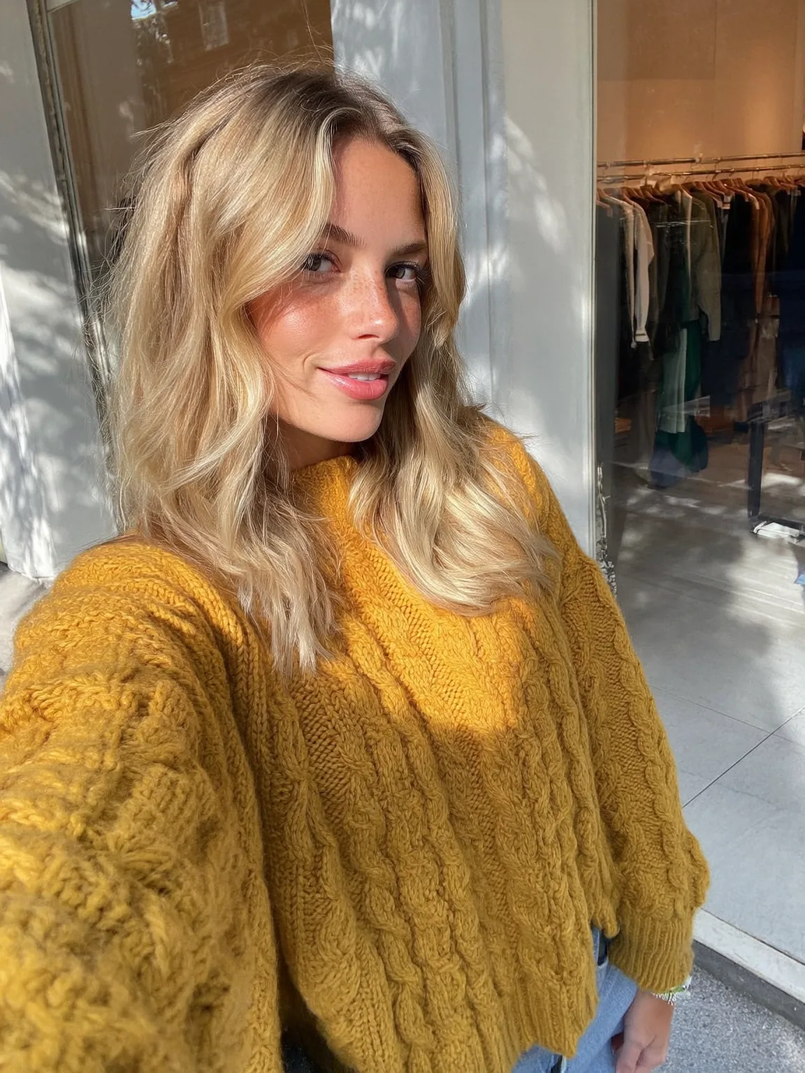 Long Wavy Layers with Sunny Blonde and Curtain Bangs